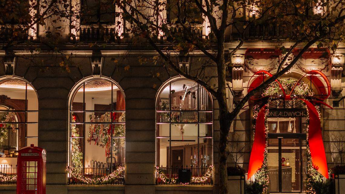 The grand red-bow entrance at One Aldwych sets the tone for a lavish London holiday stay.