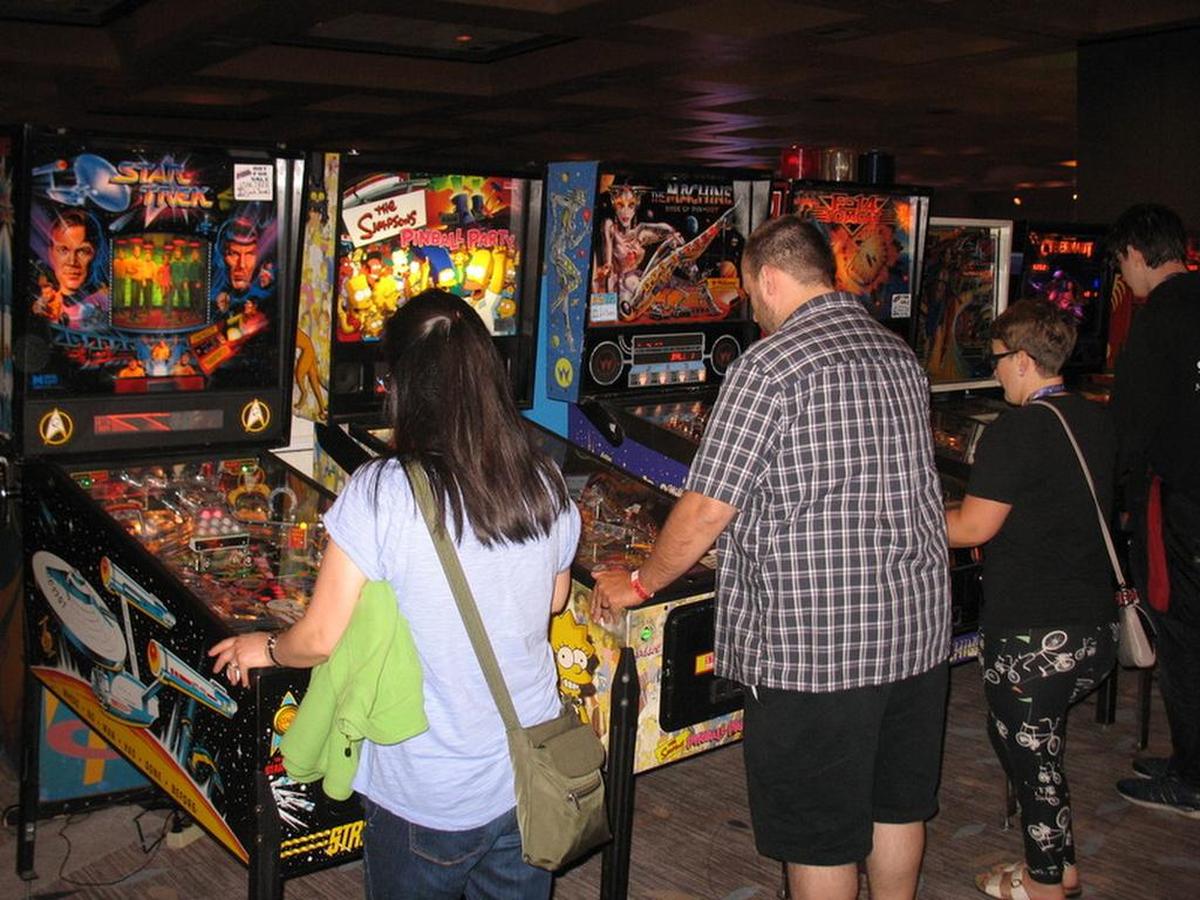 Patrons play classic pinball machines.