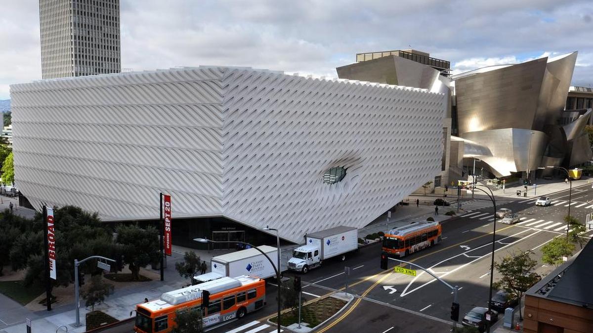 Since The Broad Museum, foreground, opened in downtown Los Angeles, lengthy lines to gain admission (free) have been the norm. Beside it is the Walt Disney Concert Hall.