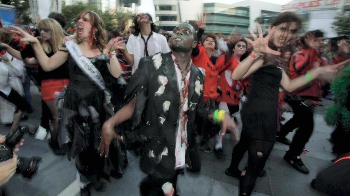 Several hundred costumed dancers participate in Thrill the World in downtown Los Angeles on Oct. 24, 2009.