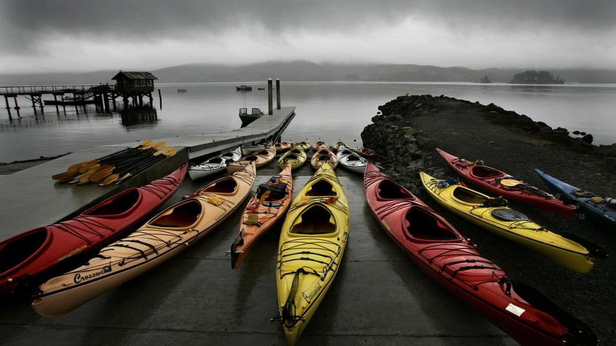 A colorful array of kayaks brightens up a foggy day along Tomales Bay, the site of Nick’s Cove, a cozy new complex that stretches alongside Highway 1 just north of the town of Point Reyes, Calif.