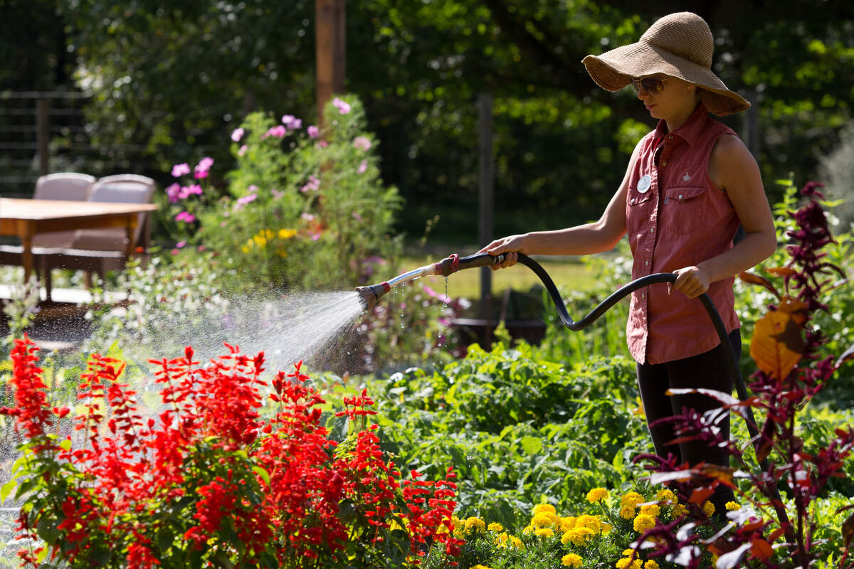 Guests tend the on-site farm at The Lodge at Woodloch, a cornerstone of its farm-to-table wellness experience.