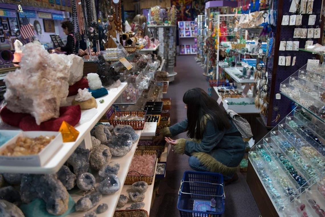 Spiritual seekers search through crystals at Mount Shasta’s Soul Connection store, Saturday, April 29, 2017. Mount Shasta’s giant peak, the largest in north America, is a mountain of mystery, attracting spiritual questers from across the globe.