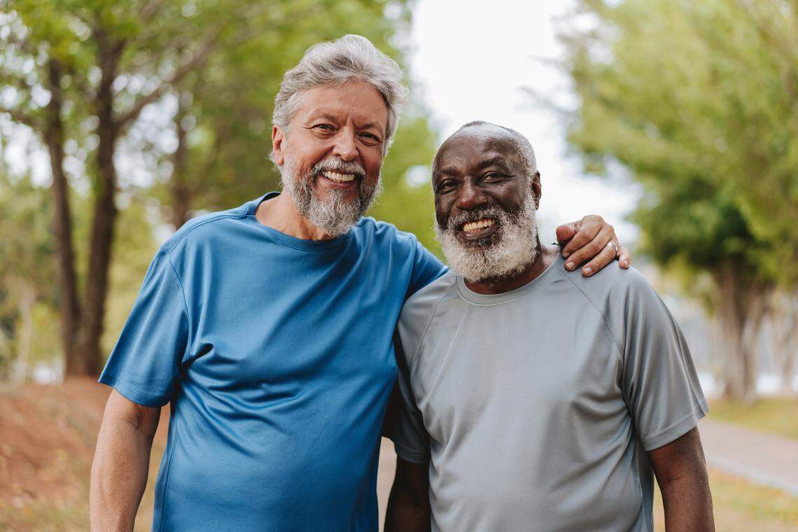 Portrait of two senior friends looking at camera