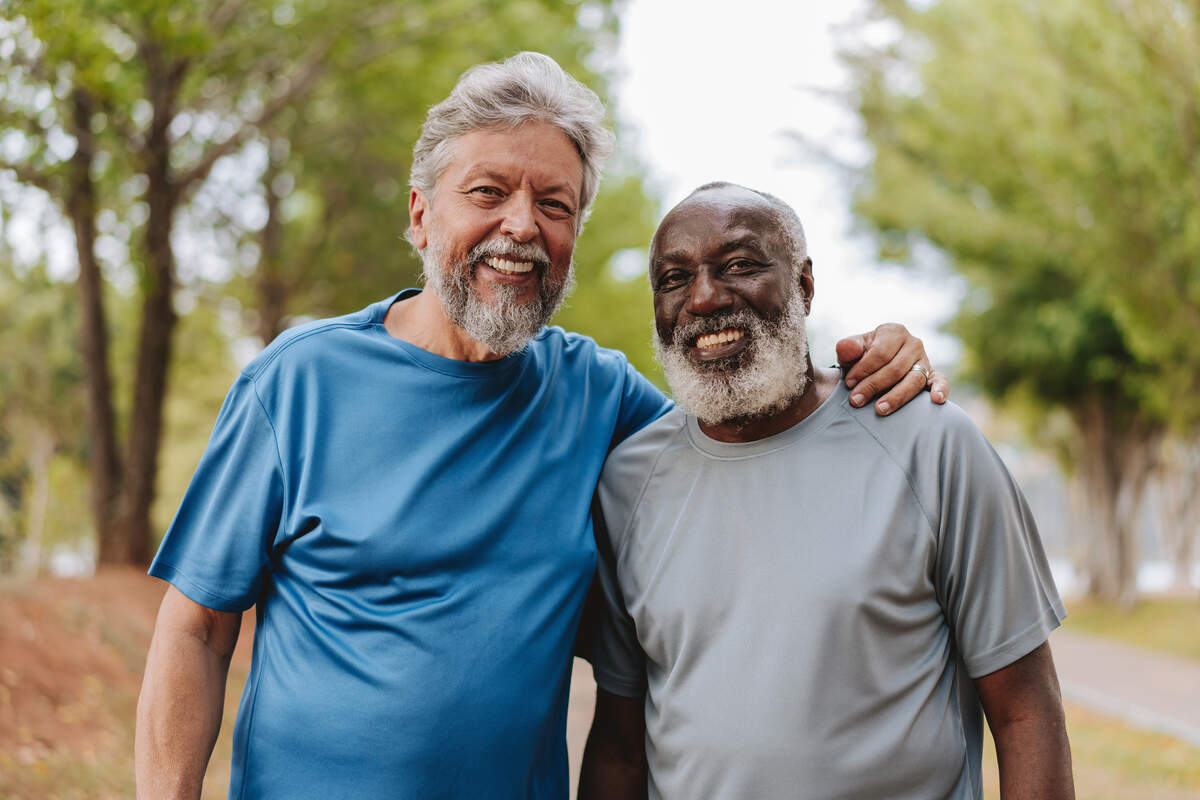 Portrait of two senior friends looking at camera