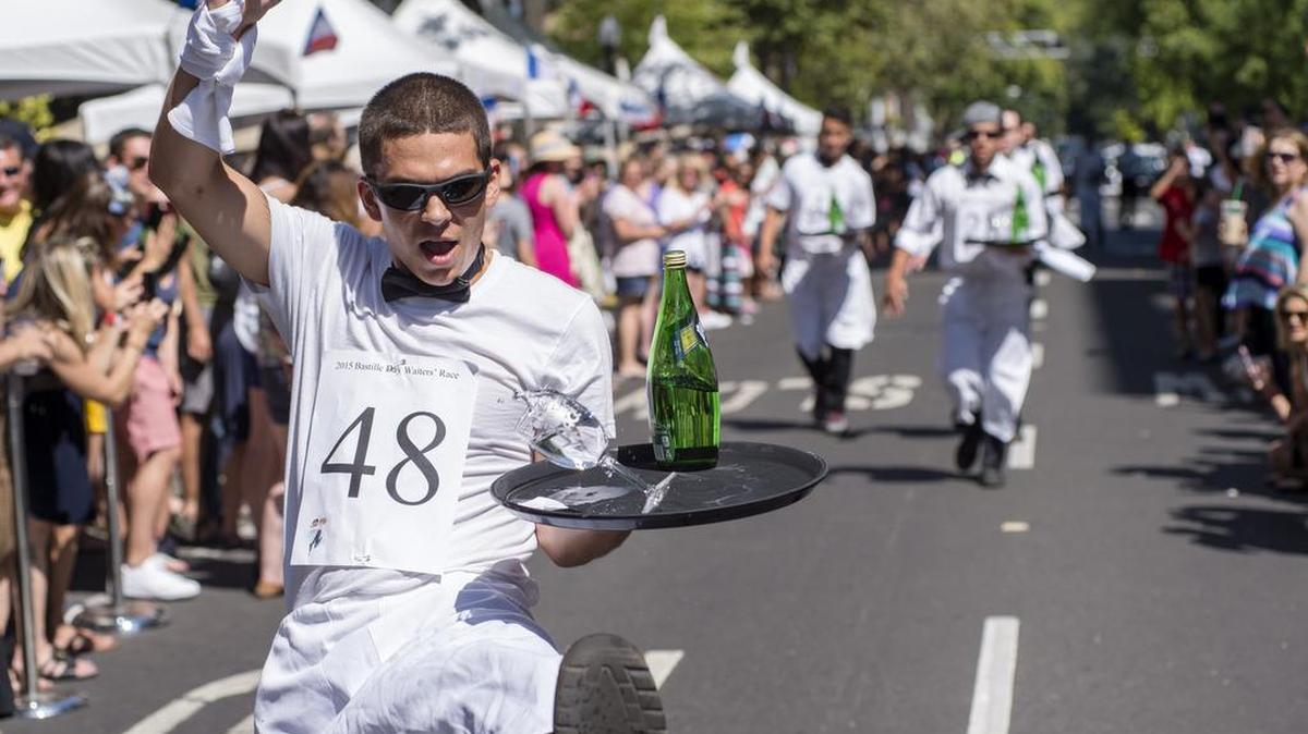 Philip Duckworth from Iron Grill drops his tray just before the finish line in 2015.