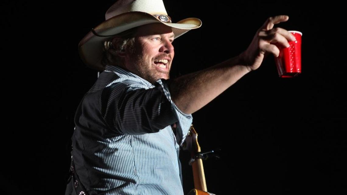 Toby Keith toasts his fans with a red Solo Cup, the name of one of his hit songs, on April 26, 2013 during the first day of the Stagecoach Country Music Festival.