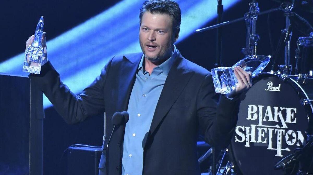 Blake Shelton accepts the awards for favorite album for "If I'm Honest" and favorite country male artist at the People's Choice Awards at the Microsoft Theater on Wednesday, Jan. 18, 2017, in Los Angeles.