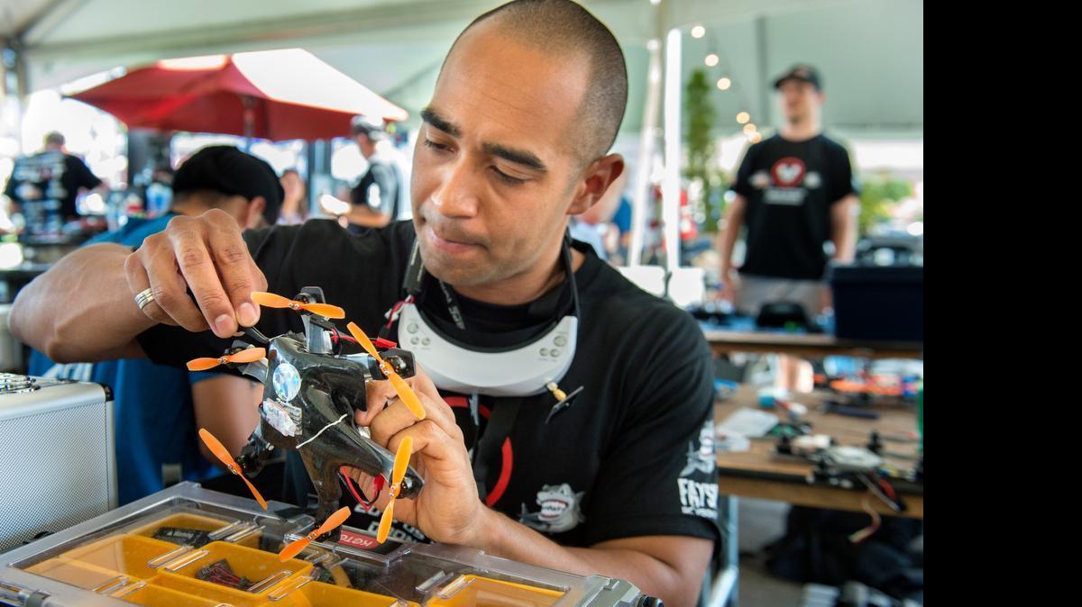 
Grant Hooks, of Orange County, prepares his craft  for a race during the drone racing preliminary heats at the California State Fair on Thursday.
