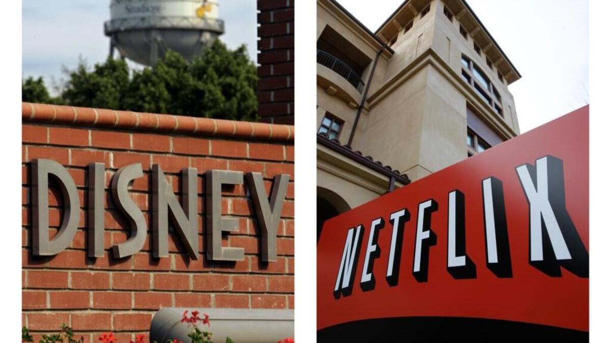 This combo photo shows the Disney and Netflix logos. Disney is set to take its content off Netflix and will start its own streaming service in 2019.
