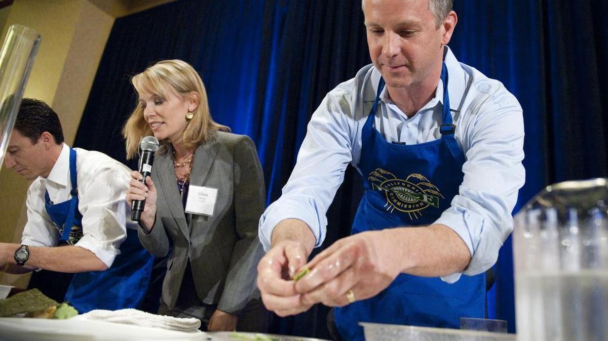 Eileen Javora, KCRA 3 Meteorologist, center, moderates a food contest between legislators in 2011.