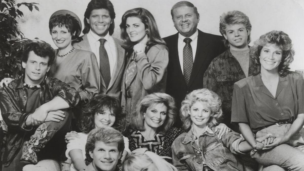 
Lorimar Television Company’s 1987 photograph of the cast “Eight Is Enough” Bradford Family. from left to right, back row: Willie Aames as Tommy; Laurie Walters as Joanie; Grant Goodeve as David; Joan Prather as Janet, David’s ex-wife; Dick Van Patten as Tom Bradford; Adam Rich as Nicholas; Lani O’Grady as Mary. Left to right, middle row: Connie Needham as Elizabeth; Mary Frann as Abby Bradford; Dianne Kay as Nancy. Left to right, front row: Brian Patrick Clarke as Merle Stockwell; Susan Richardson as Susan, Merle’s wife.

