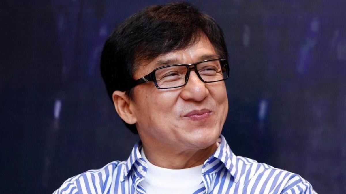 FILE - In this Dec. 18, 2013, file photo, Hong Kong actor Jackie Chan smiles during a news conference to promote his new film “Police Story 2013,” in Kuala Lumpur, Malaysia. On Thursday, Oct. 5, 2017, Chan confirmed work on a fourth “Rush Hour” movie, if Chris Tucker is on board.