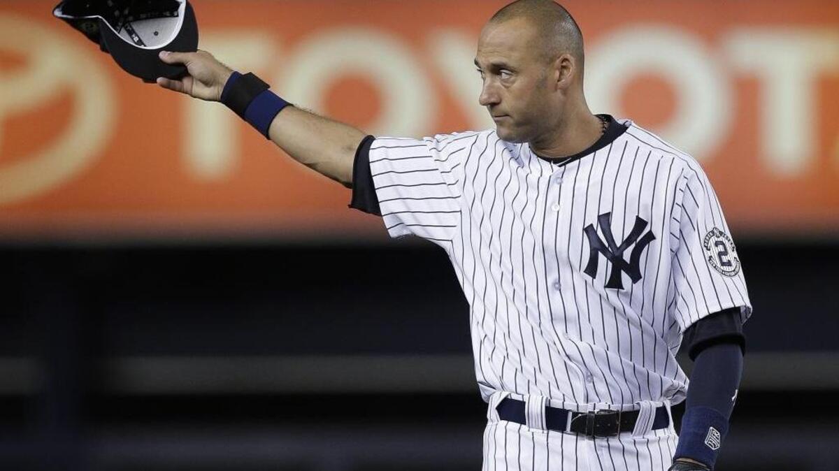 New York Yankees shortstop Derek Jeter acknowledges applause from fans as he takes the field for a baseball game against the Baltimore Orioles, Thursday, Sept. 25, 2014, in New York. The game is Jeter's last home game of his career.