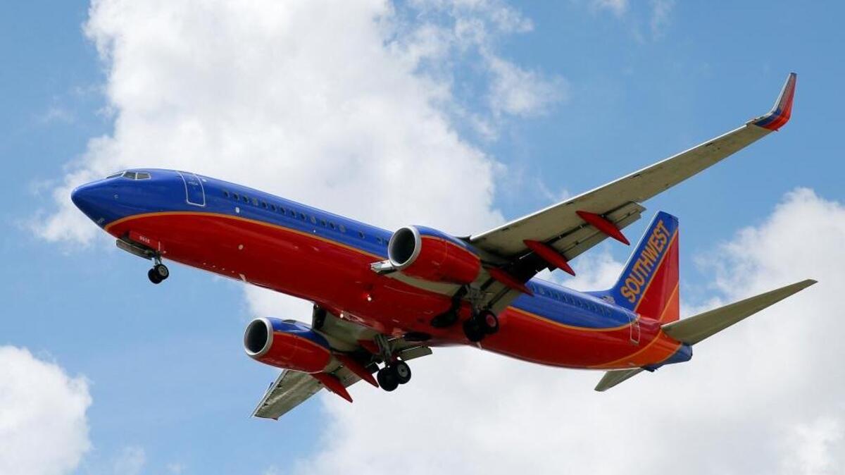 FILE - In this Aug. 26, 2016, file photo, a Southwest Airlines jet makes its approach to Dallas Love Field airport, in Dallas.