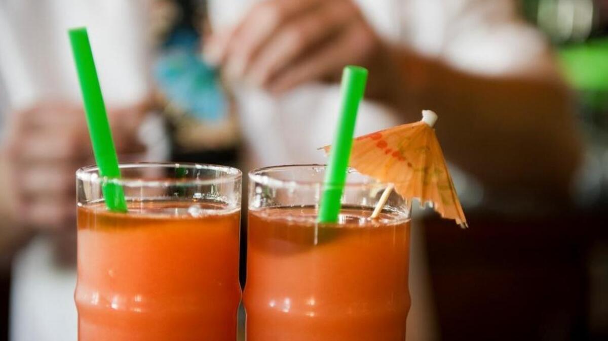 A bartender prepares two of their famous Wet Woody drinks at Gar Woods Grill and Pier in Carnelian Bay on the north shore of Lake Tahoe. The restaurant is expecting to reach a milestone of having sold 2 million wet woodies this year. The beverage is a strong rum drink blended with a variety of fruit juices.