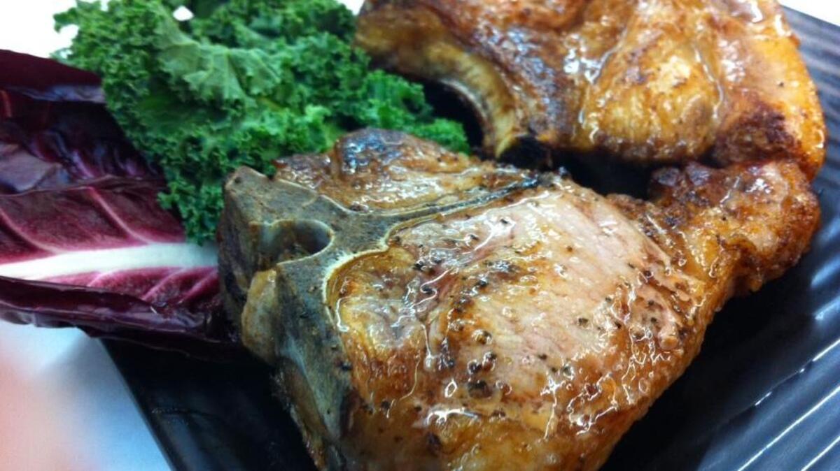 Chops from heritage pork were seasoned with salt and pepper and cooked in a splash of olive oil at Corti Bros. Market.