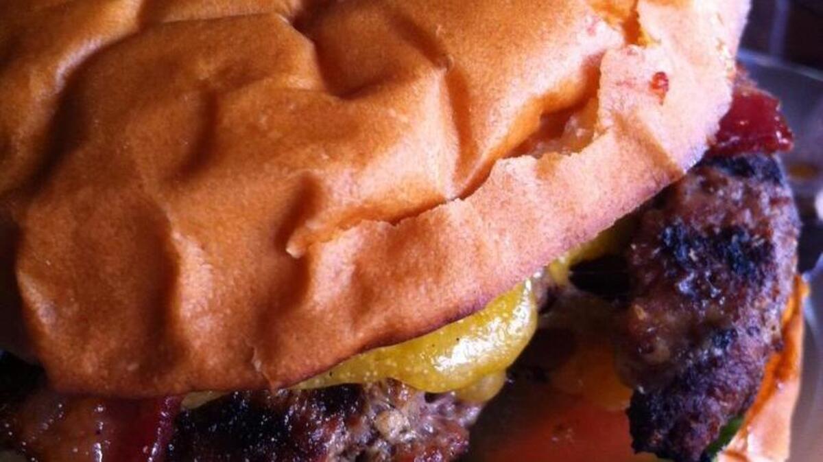 Pangaea won the judge's choice at the 5th annual Sacramento Burger Battle. In this photo from the restaurant, a burger at the Pangaea pub includes bacon, cheese, lettuce, tomato, onion and house-brined pickle chips.