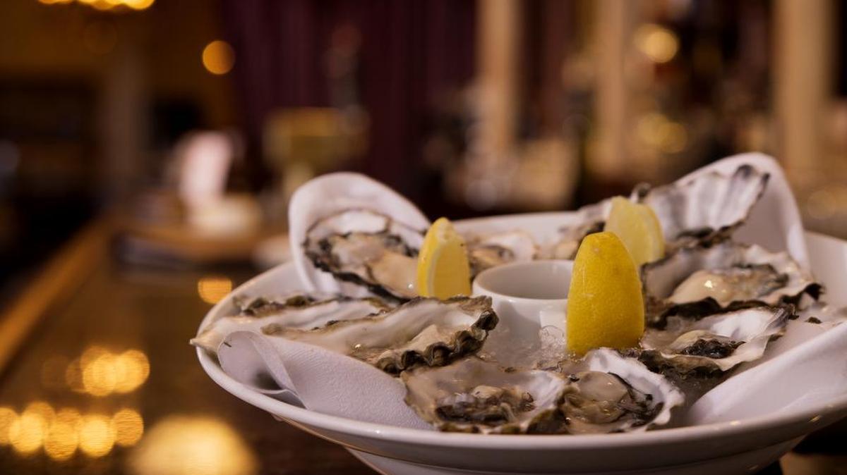 FILE -- A dozen Happy Hour Oysters, from Hood Canal, Washington, $12.00 at The Firehouse on Tuesday, April 5, 2016.