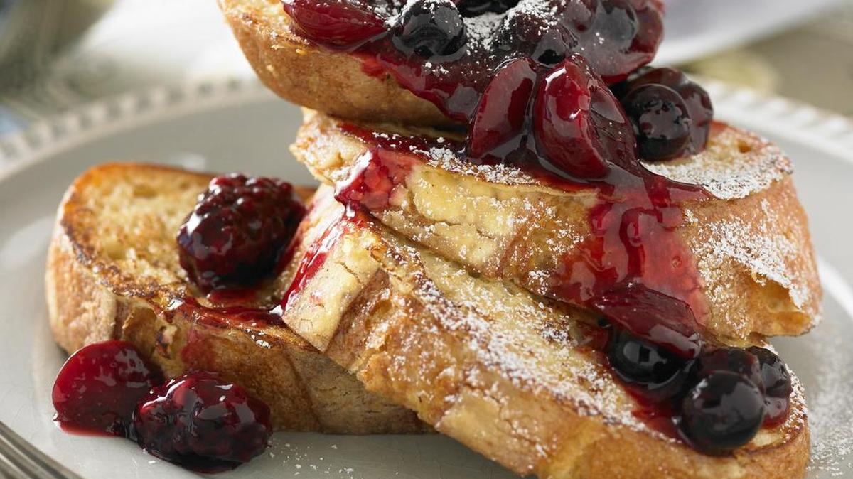 Baked French toast with Cherry-Berry Breakfast Topping is perfect for Sunday brunch.