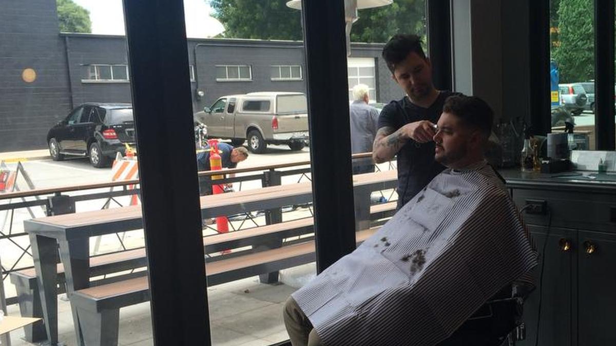 Anthony Giannotti, one of the owners of Bottle and Barlow, gives a haircut earlier this year. Giannotti’s entire seven-person barber staff of independent contractors quit rather be reclassified as employees, he said. It’s one of the first local dominoes to fall as a result of state Supreme Court’s decision in April of Dynamex Operations West Inc. v. Superior Court, which redefined who can work as an independent contractor.