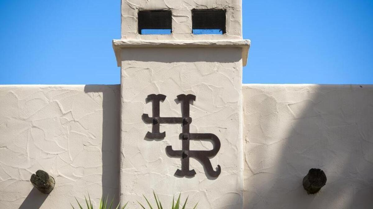 The Harris Ranch logo on the outside of the Harris Ranch Inn & Restaurant in Coalinga, Calif.