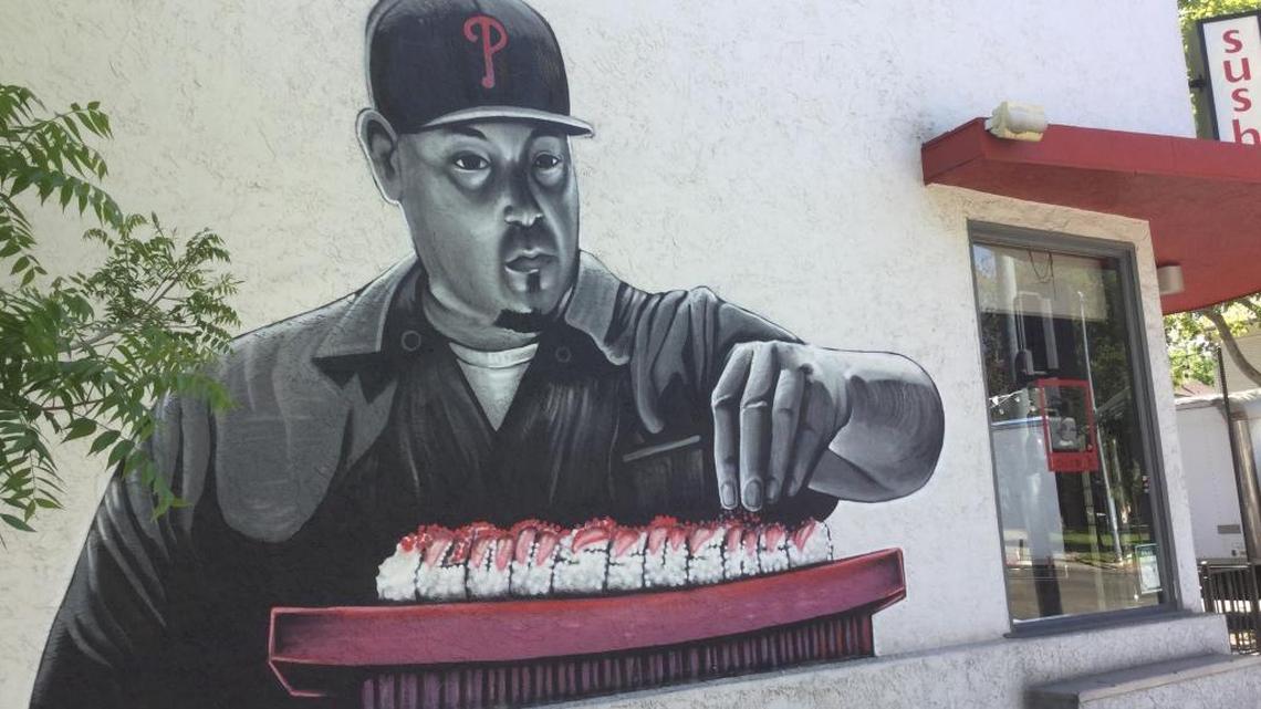 Lou Valente is depicted in a mural on the side of Lou’s Sushi on 28th and P Streets, but Valente himself has been absent from the restaurant since early April due to underlying business disputes including a set of lawsuits.
