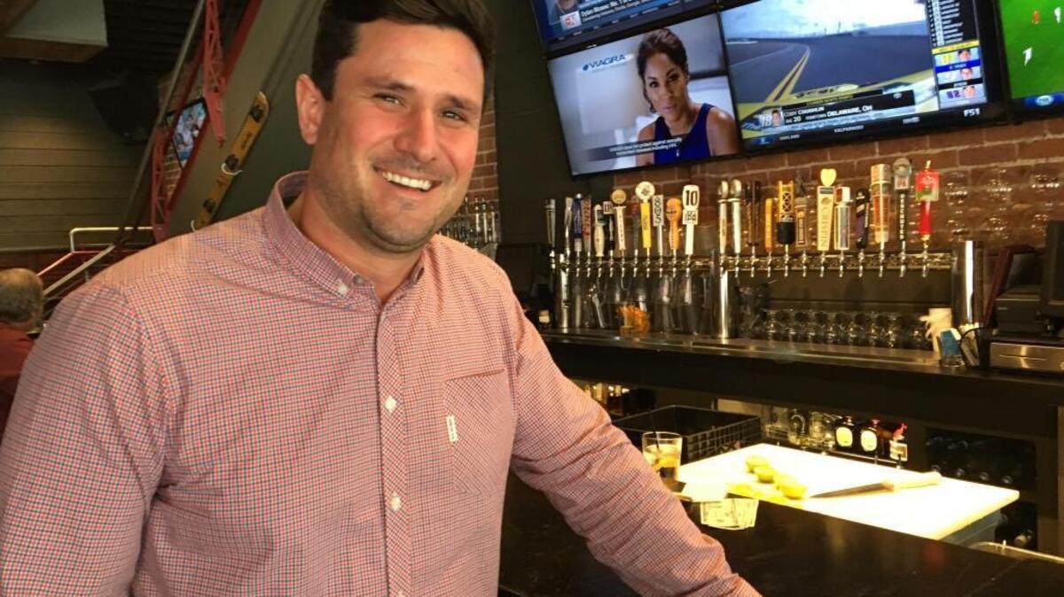 Trevor Shults stands before BarWest’s new 24-tap system.