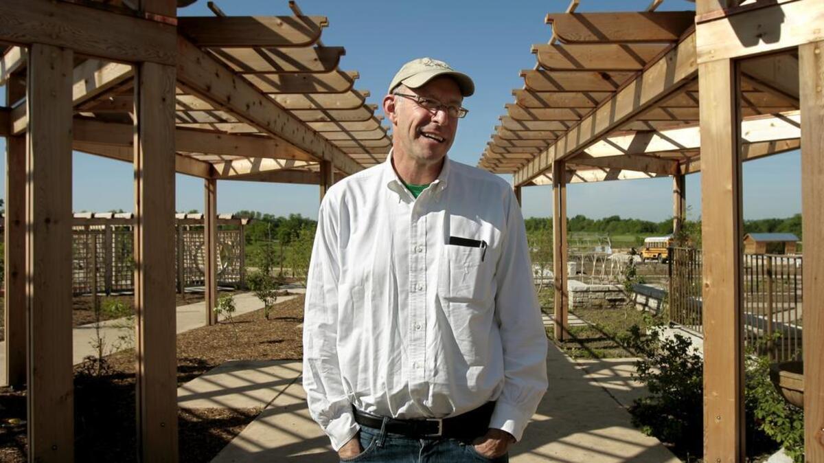 
Michael Pollan, shown visiting a $9.2 million, 12-acre “harvest garden” outside Kansas City in May, says that “on the whole” he is encouraged by the direction of world food production.
