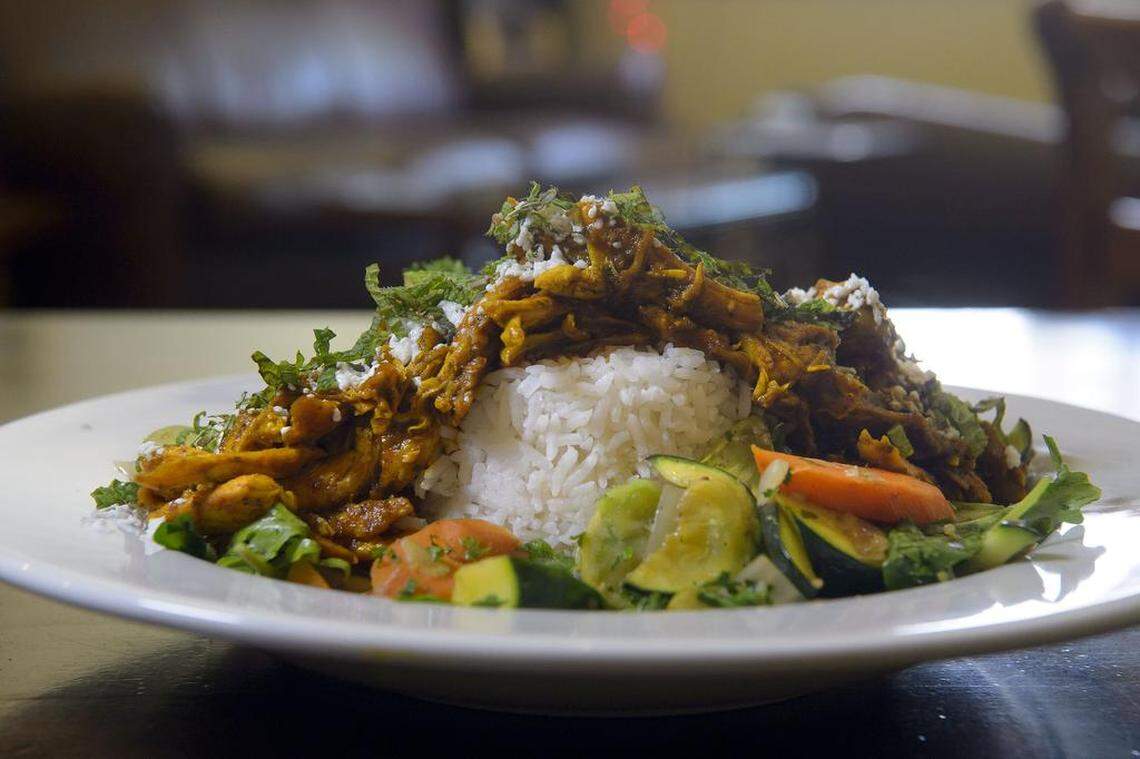 The Chicken Power Bowl at Backbone Café has free-range chicken in mahogany sauce, topped with organic mint and feta cheese over white rice and organic roasted vegetables.