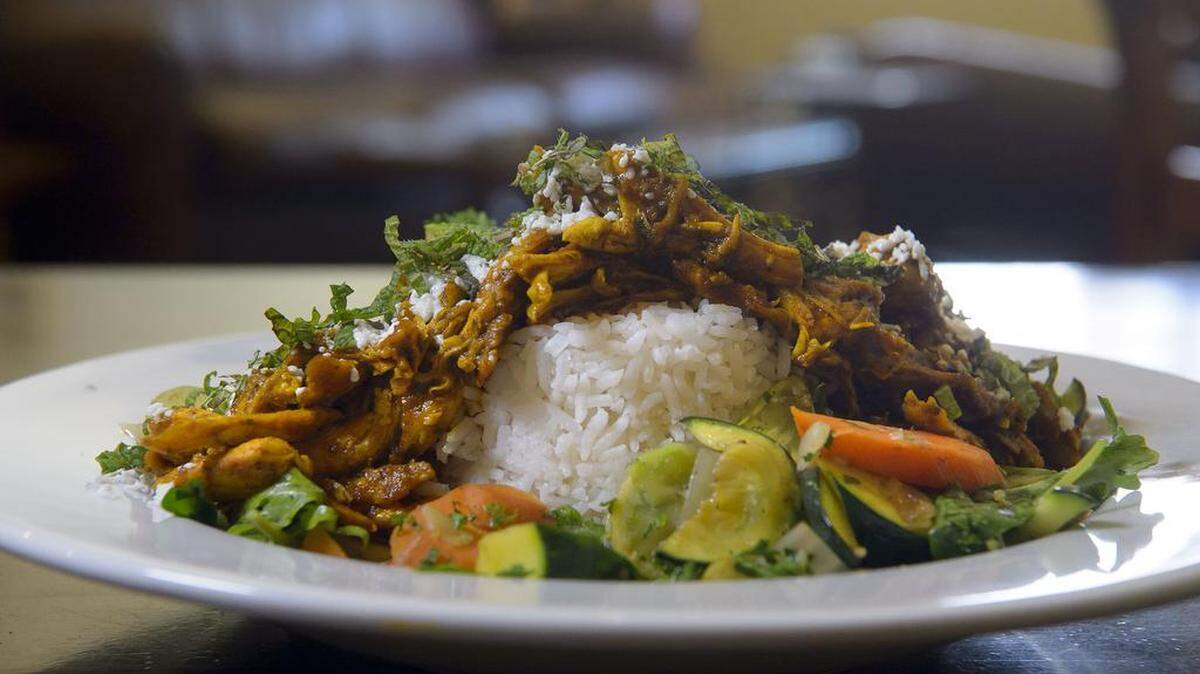 The Chicken Power Bowl at Backbone Café has free-range chicken in mahogany sauce, topped with organic mint and feta cheese over white rice and organic roasted vegetables.