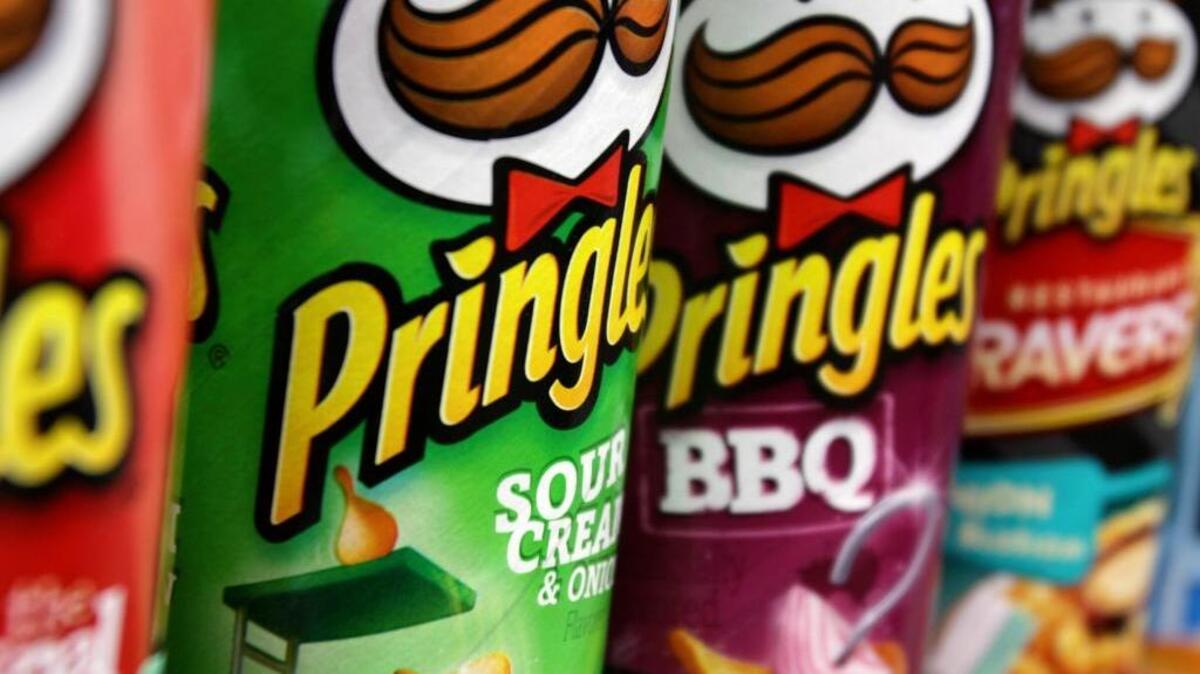 Pringles chips are displayed in a store. Kellogg’s, the makers of the chips, and Nissin have teamed up on a new chip flavor: Pringles Top Ramen Chicken.