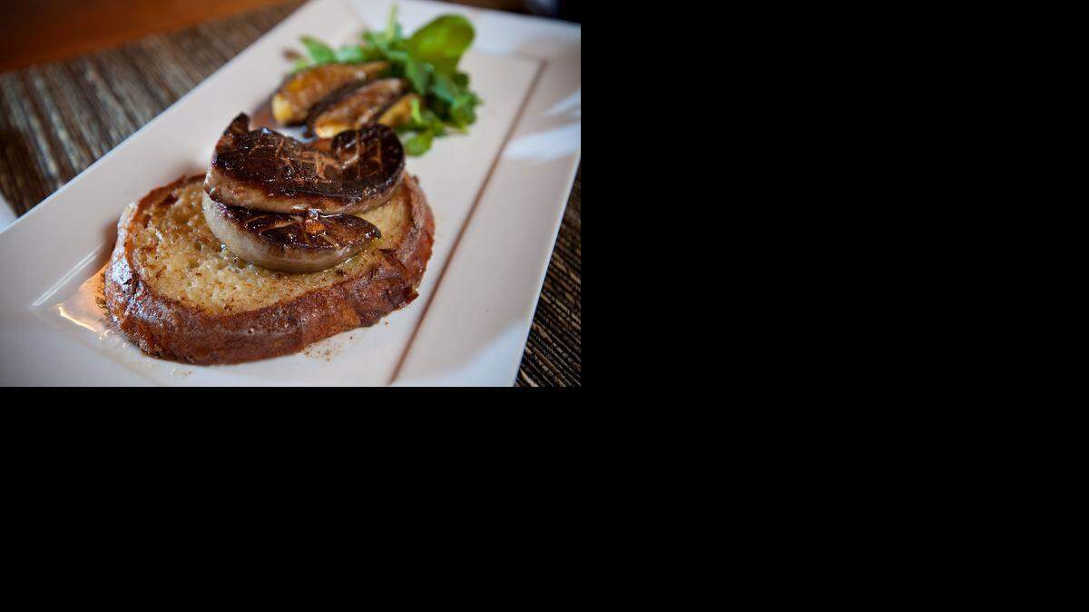 
Seared foie gras on pain perdue, with fig and arugula is seen at Mulvaney’s B&L restaurant in Sacramento on June 19, 2012. Foie gras, or fatty liver, is considered among the world’s great delicacies but others shudder at the force-feeding methods it takes to engorge animal livers.
