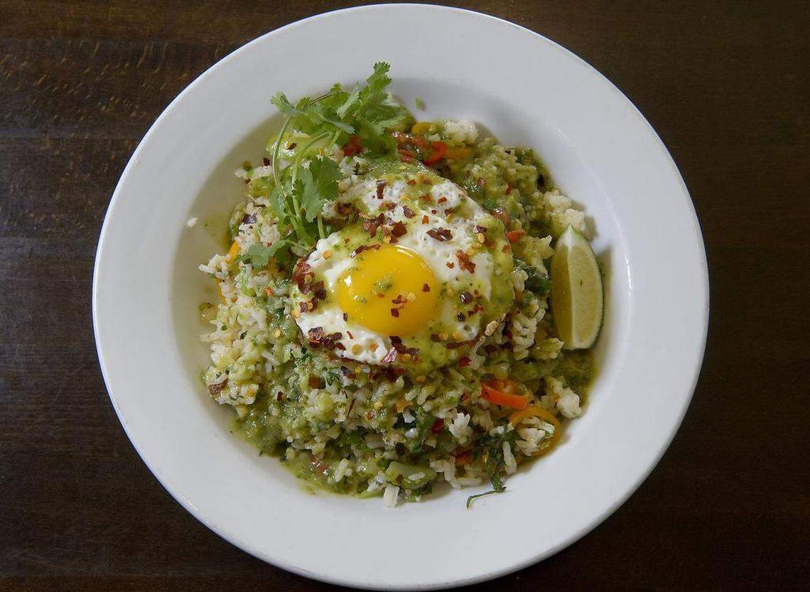 The fried rice breakfast dish at Backbone Café includes organic white rice with celery, organic yellow onions, organic toyboy chilli peppers, organic garlic, cilantro and lime topped with a free-range egg and salsa verde.