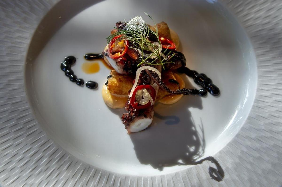Allora restaurant’s polpo appetizer includes sous vide octopus with a faintly sweet glaze, a pool of ink and gnocchi.