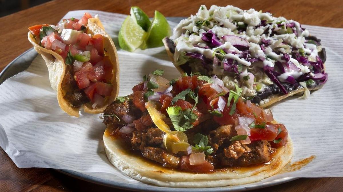 Tostada, vampiro and carnitas tacos at La Venadita taqueria in Oak Park on Tuesday, August 2, 2016.