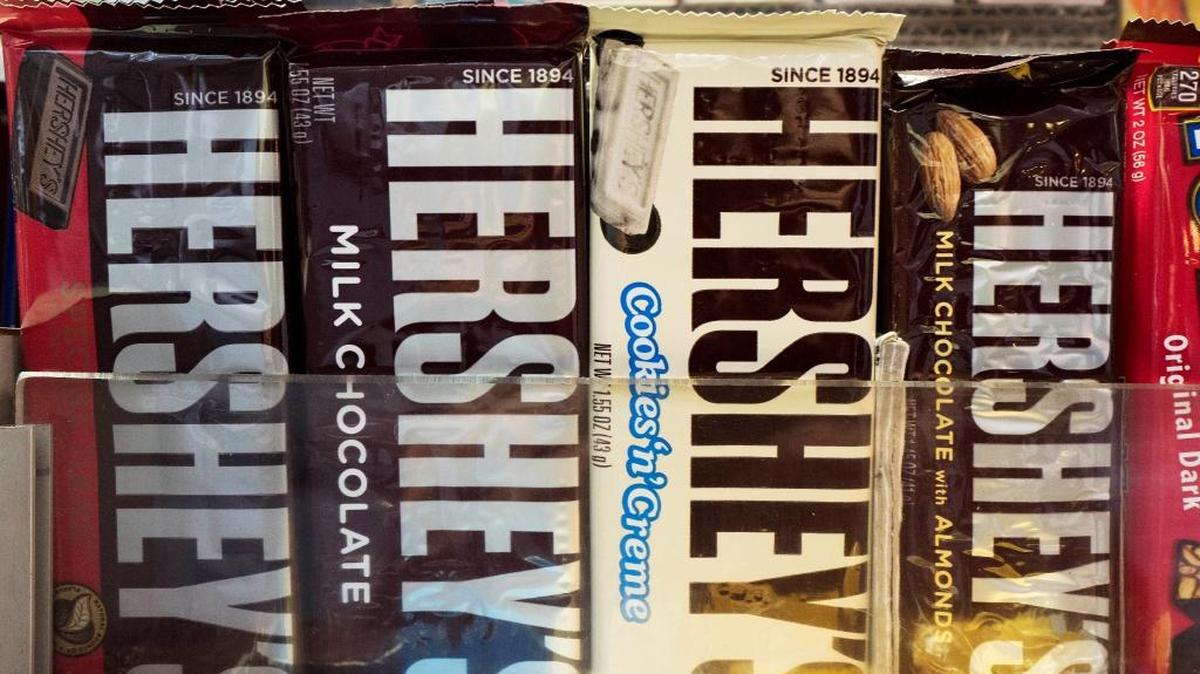 In this Friday, Oct. 7, 2016, photo, Hershey's chocolate bars are displayed on a newsstand, in New York.