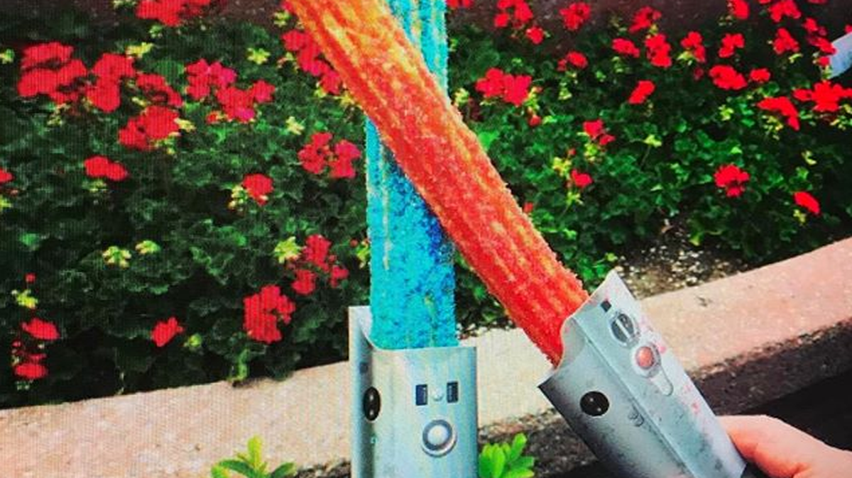 Eating a lightsaber may not sound like much fun, but how about a lightsaber churro? The treats are on sale at Disneyland through the end of the month.