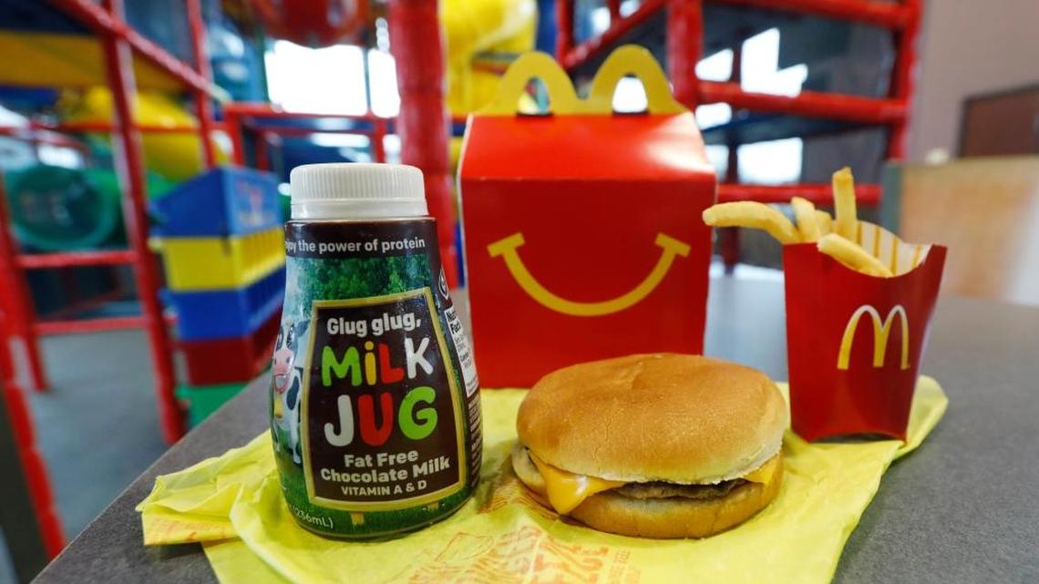 A Happy Meal featuring non-fat chocolate milk and a cheeseburger with fries, are arranged for a photo at a McDonald’s restaurant Wednesday in Brandon, Miss.