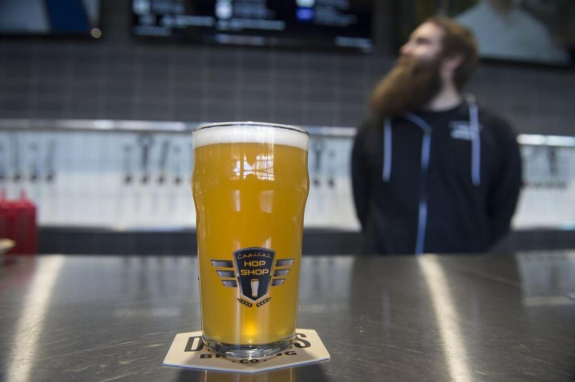 “Make It Rain,” an IPA from New Glory Craft Brewery, is one of 40 offered at the Capital Hop Shop.