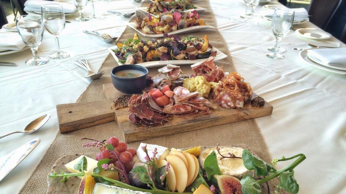 
In a preview of the 2015 Farm-to-Fork Gala Dinner, platters of the featured courses are lined up on a banquet table at the Citizen Hotel in Sacramento. 
