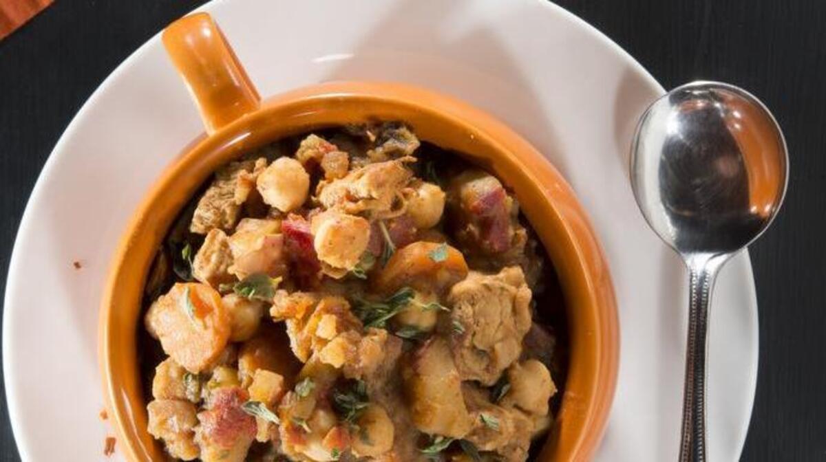 This spicy stew includes chickpeas (garbanzo beans), carrots, sweet potatoes, red pepper and butternut squash, in addition to chicken.