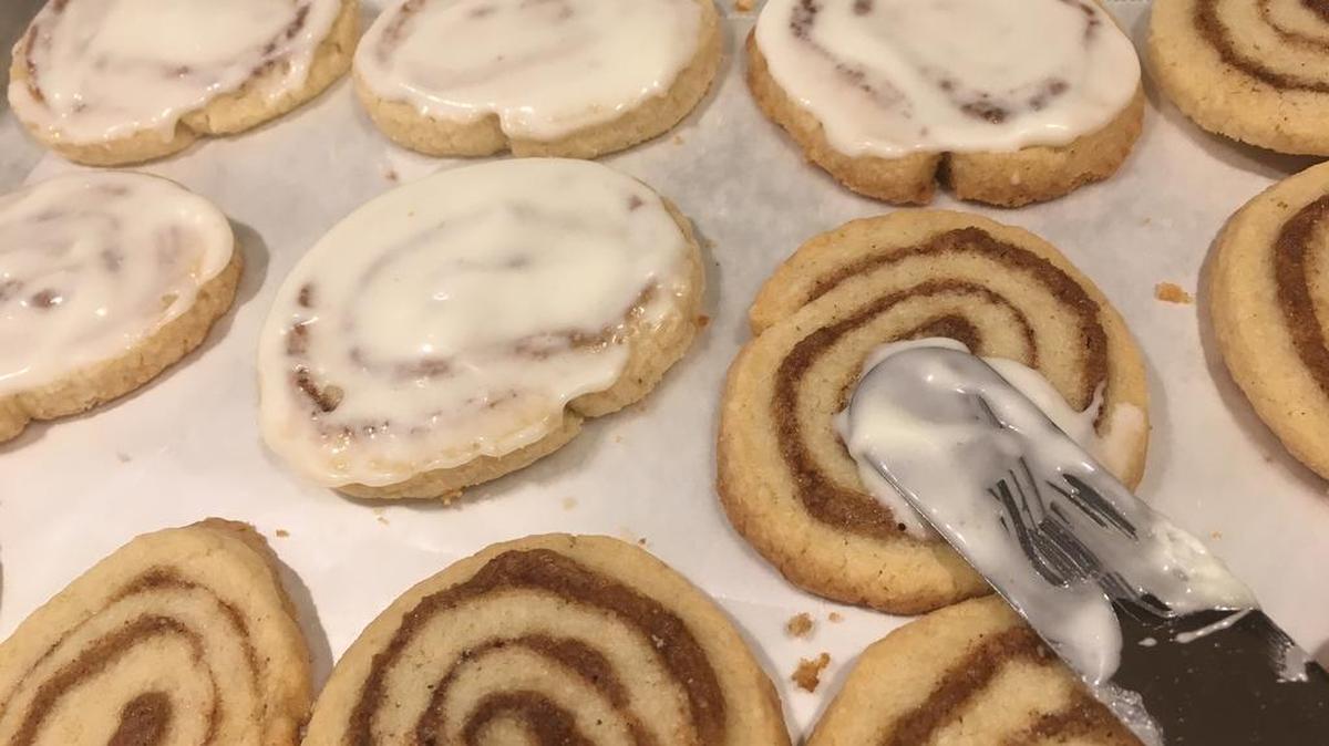 Cinnamon roll cookies get their cream cheese icing.