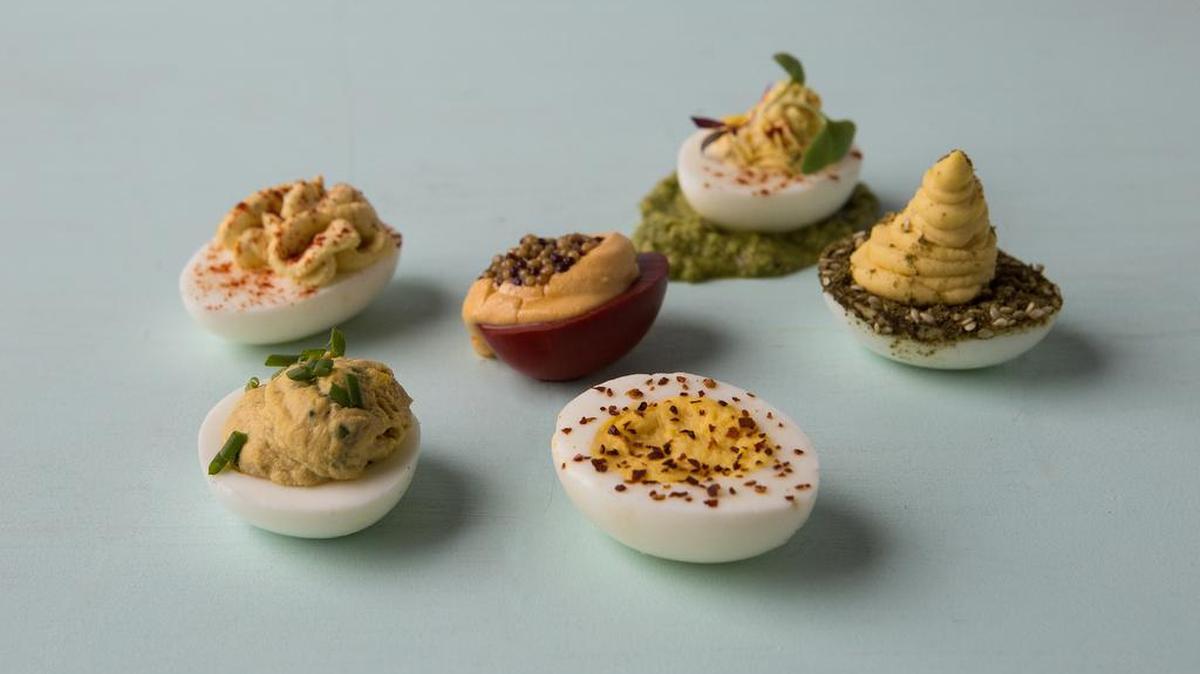 Why choose between them? Make a sampler for your next get-together. From left to right: horseradish deviled eggs (in back); Lourdes’ deviled eggs with foie gras and tuna; beet-pickled deviled eggs; less-devilish eggs; homestead deviled eggs and hummus deviled eggs.