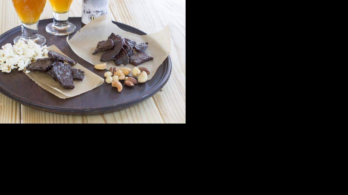 
Serve homemade jerky with those beers at your Super Bowl party. The meat is marinated before drying, which lets you adjust the flavors to personal preference.
