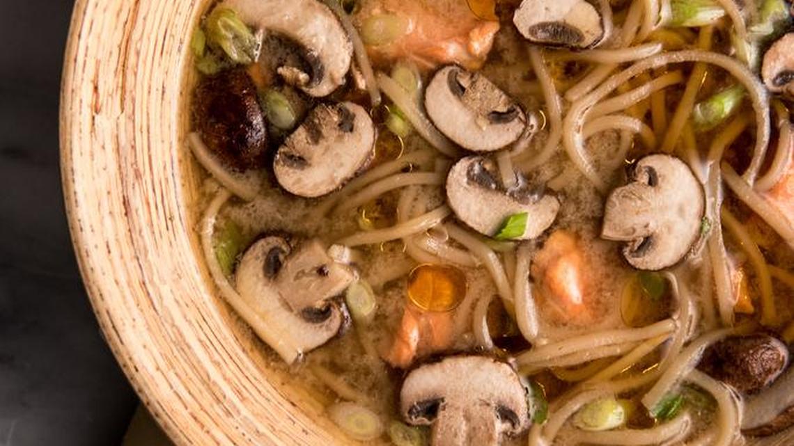 Poached salmon soup with udon and mushrooms