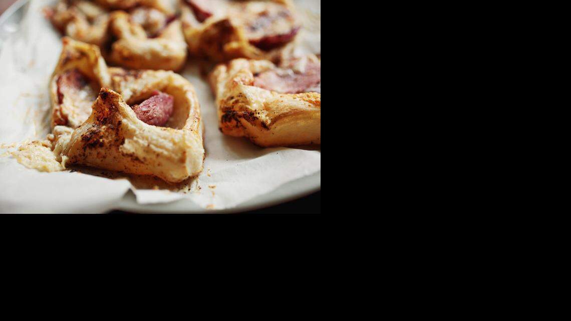 
Frozen puff pastry and leftover ham, plus cheese, go into these pastry puffs.
