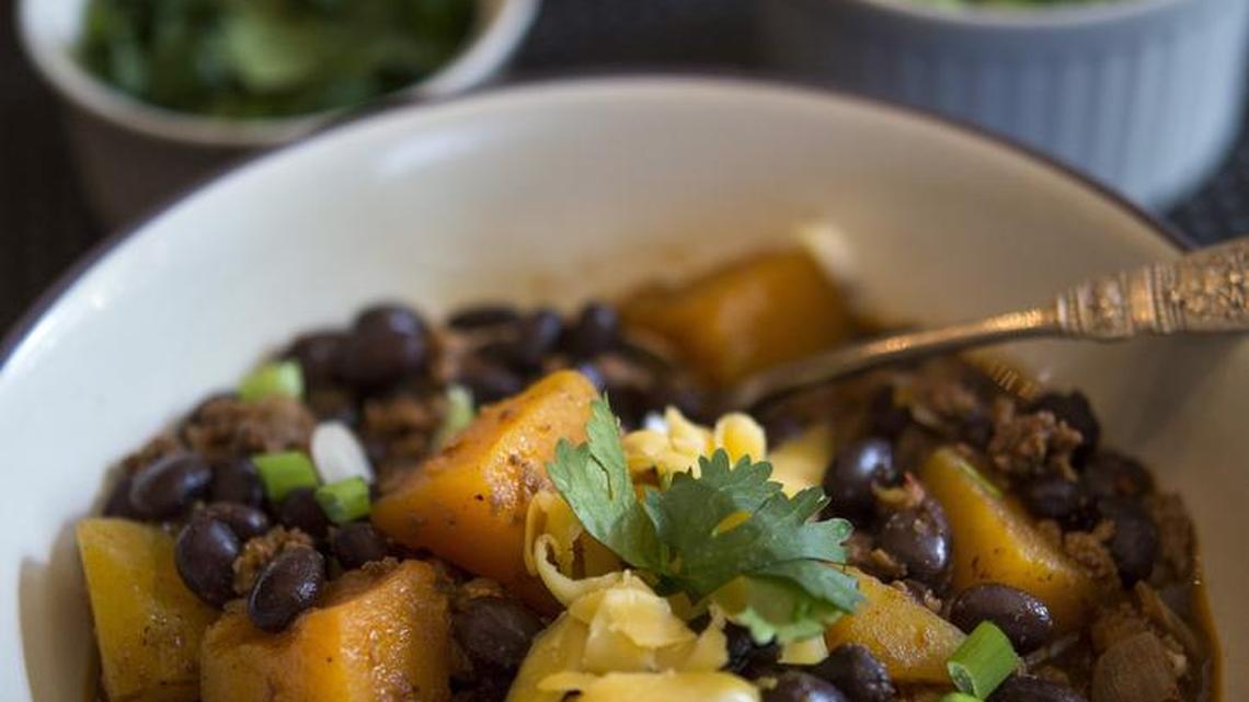 Black and orange chili (black bean chili with ground turkey and chunks of sweet potato or butternut squash) can be the focal point of any Halloween buffet.