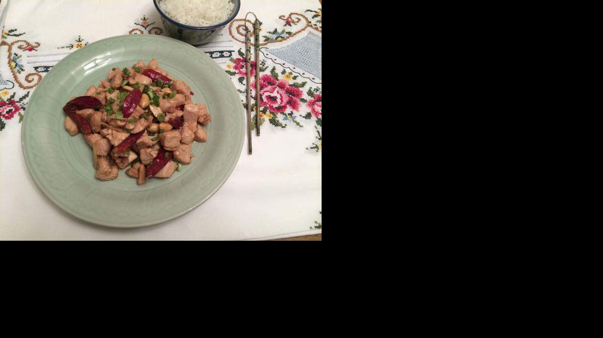 
Writer Elaine Corn’s kung pao chicken, the recipe for which is on Page D2, includes dried chili peppers, scallions and peanuts. 
