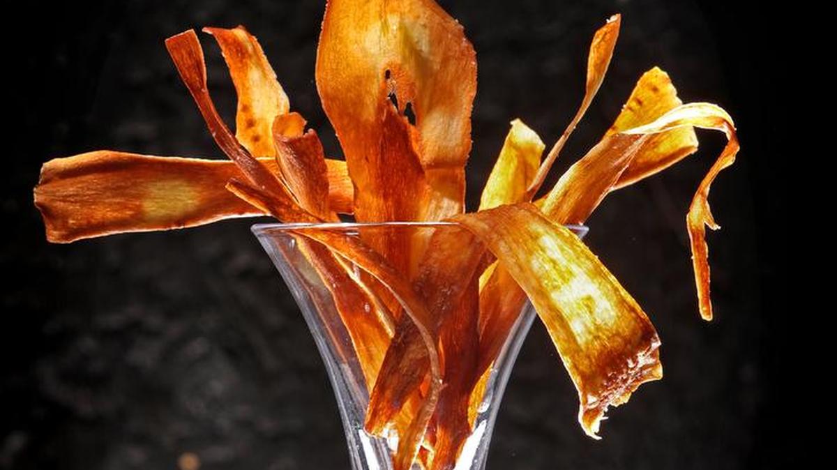 Parsnip chips are a surprising take on root vegetables. Try them for a snack before the big dinner.
